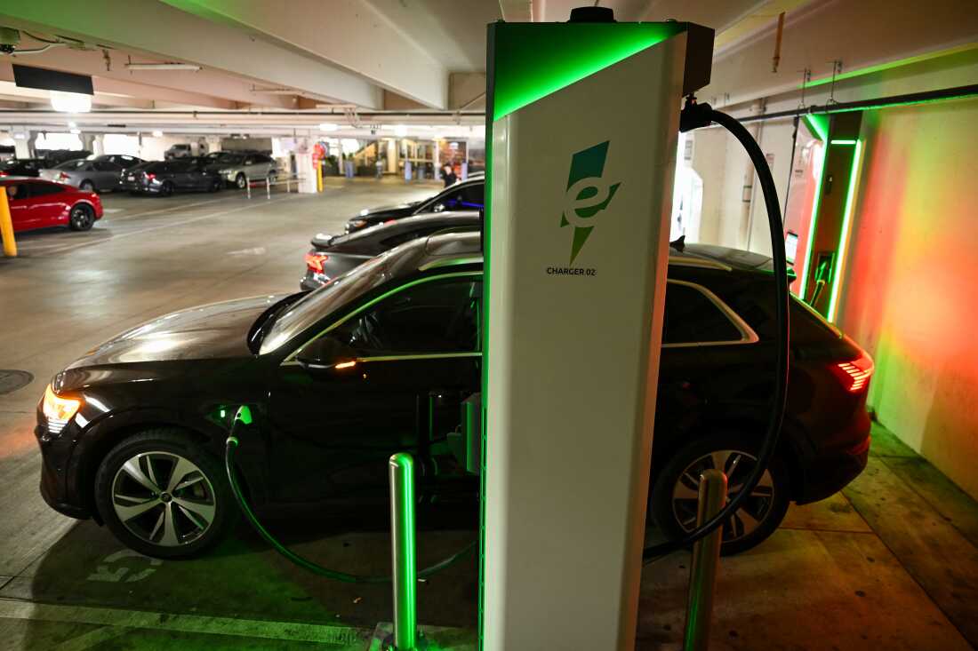 An electric car charges at the Electrify America public charger that runs the current race in Los Angeles on May 16.